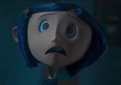 A Creepy Doll With Blue Hair And Eyes Looking At Something In The