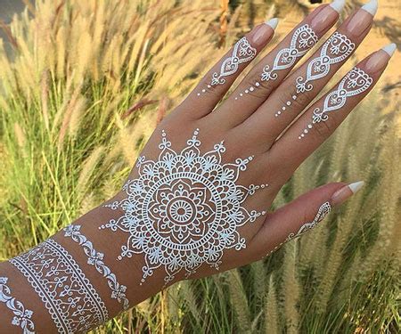 The design features stunning black lace with pretty white roses. White Lace Henna Tattoos - Awesome Stuff 365