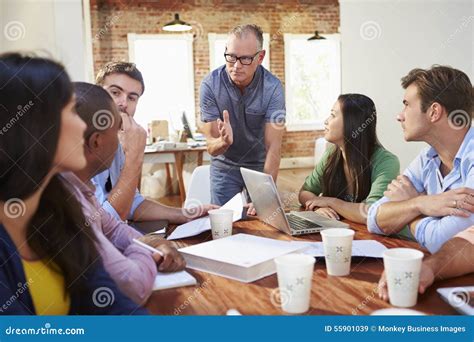 Group Of Office Workers Meeting To Discuss Ideas Stock Image Image Of