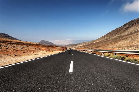 Panoramic View Of A Road Surrounded By Dry Land Hd Wallpaper