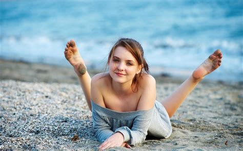 Sexy Wallpaper Smiling Girl In Sweater Lying Down On The Sand Of Beach