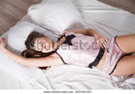 Girl Pink Pajamas Lying On Bed Stock Photo Edit Now