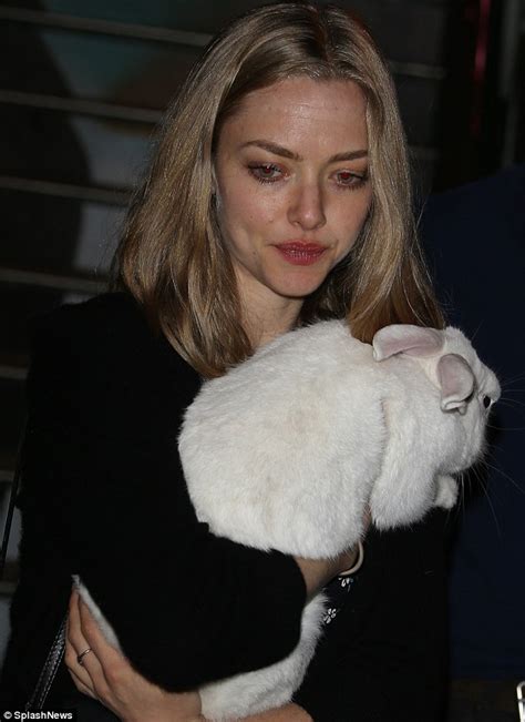 Amanda Seyfried Hugs A Fluffy Bunny Rabbit At Dylans Candy Bar Opening