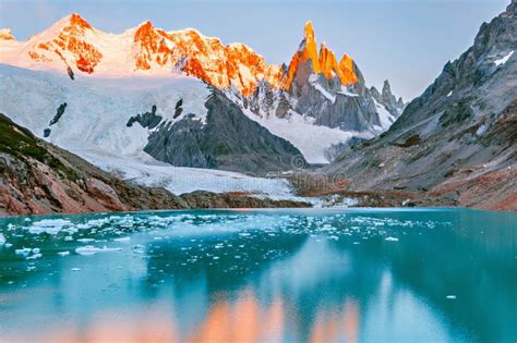 Amazing Sunrise View Of Cerro Torre Mountain By The Lake Stock Photo