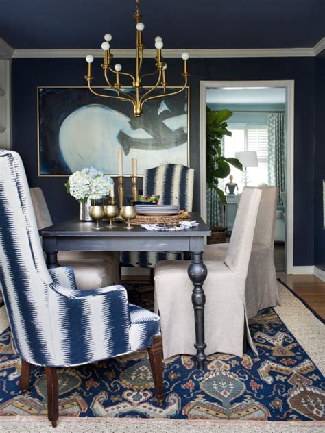 Dining out in your new navy blue dining room. Dining Room with Blue and White Chair Plus Brass Chandelier | HGTV