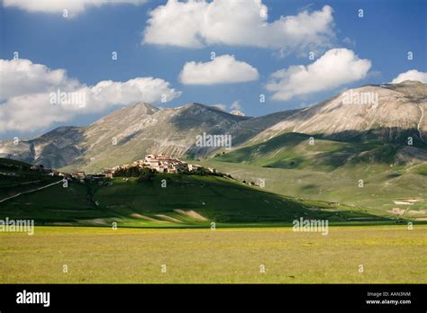 The Umbrian Village Of Castelluccio On The Piano Grande Plain In The