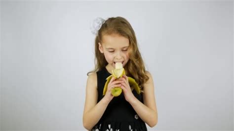 Girl Dances With A Banana A Girl Peels A Banana And Eats A Banana Happy Emotions Of A Hungry