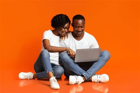 Relaxed African American Couple Using Laptop Together Stock Image Image Of Africanamerican