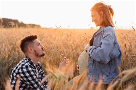 Premium Photo Beautiful Moments Of Pregnancy Young Man Gives Bouquet Of Flowers To His