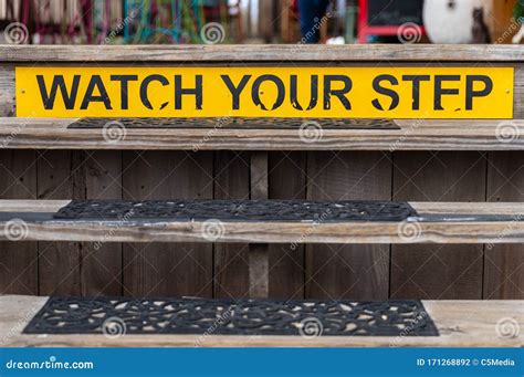 Watch Your Step Sign On A Wooden Set Of Stairs Stock Photo Image Of