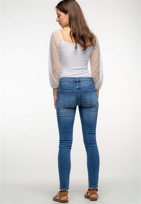 Mid Rise Distressed Denim Skinny Jeans Shop Denim At Papaya Clothing