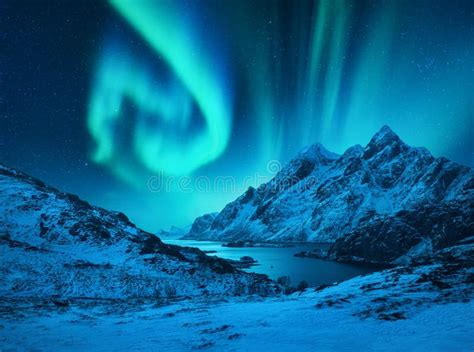 Aurora Borealis Above The Snow Covered Mountains Stock Photo Image Of
