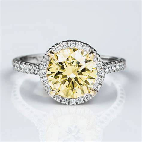 The vibrant golden hue sets them apart from other yellow diamond engagement rings are fresh. Round Halo Fancy Light Yellow Diamond Engagement Ring, 2 ...