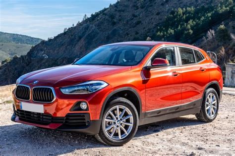 Bmw X2 Car Parked At Dirt Road In Mountains Orange Painted Led