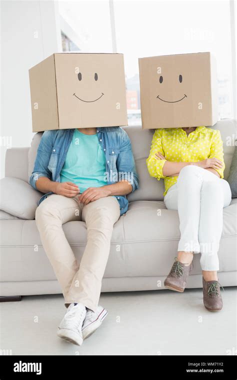 Young Creative Team Wearing Boxes On Head In Creative Office Stock