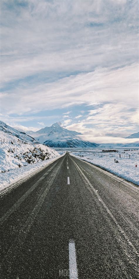 271252 An Empty Road Near Snow Covered Mountains The Most Beautiful