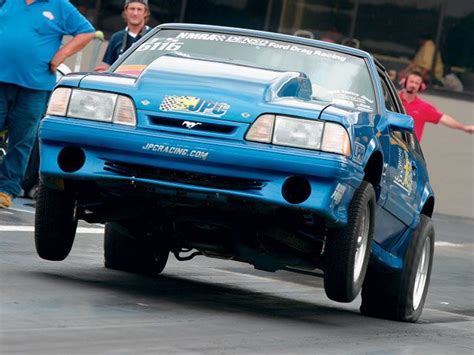 Blue Ford Mustang Foxbody Gt Doing A Wheelie At Drag Strip Mustang