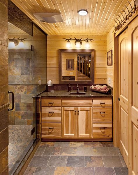 The gold hardware looks luxurious over white tiles. copper slate tile bathroom transitional with small space ...