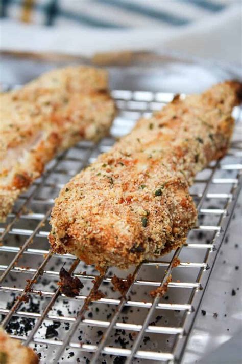 Line rimmed baking sheet with foil. Low Carb Chicken Tenders- Made with Parmesan and Almond Flour!