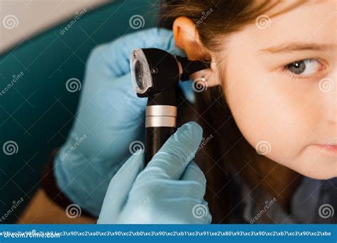 Close Up Examination Of Childs Ear With Otoscope Otoscopy Visit To