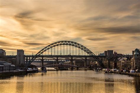 The Tyne Bridge At Sunset Reflecting In The Almost Still River Tyne
