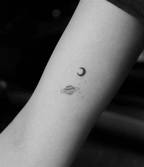 Tiny Saturn And Moon Tattoos By Jakub Nowicz Inked On The Right Arm