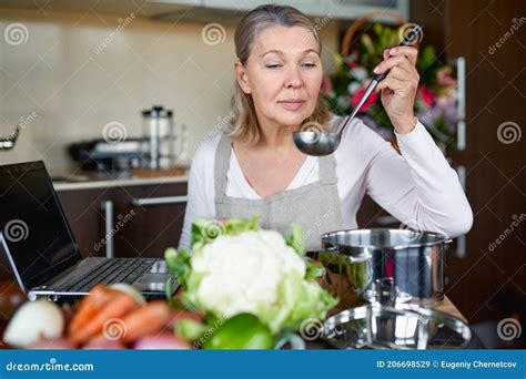 Mature Woman In Kitchen Preparing Food Stock Image Image Of Leisure