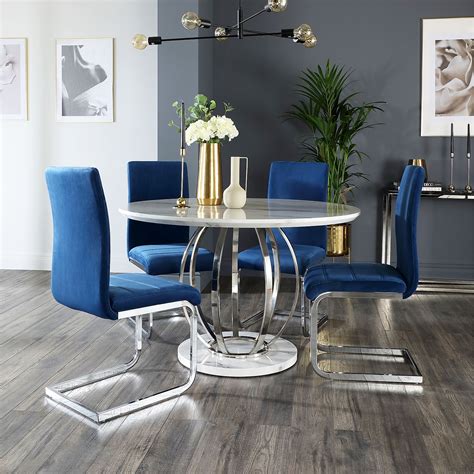Traditional charm meets modern, curvy silhouettes with the. Savoy Round White Marble and Chrome Dining Table with 4 Perth Blue Velvet Chairs | Furniture Choice