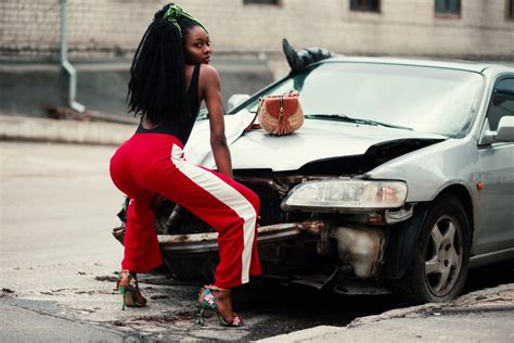 Photograph Of Woman About To Twerk In Front Of Vehicle Goldposter