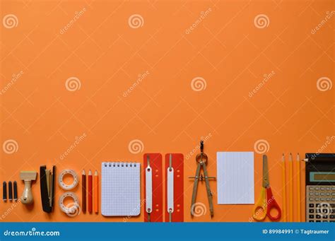 Office Or School Supplies On Orange Paperboard Stock Image Image Of