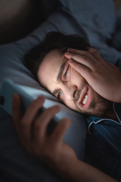 Tensed Man With Insomnia Using Blurred Stock Image Image Of Cellphone