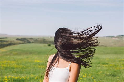 Woman Portrait When The Wind Blow Her Hair Covering Her Face By