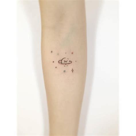 Minimalistic Saturn And Stars Tattoo Done On The Inner