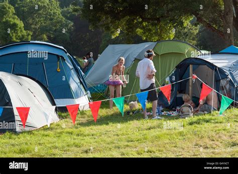 Families Partying Amongst Their Campsite Tents At The Port Eliot Festival Cornwall Stock Photo