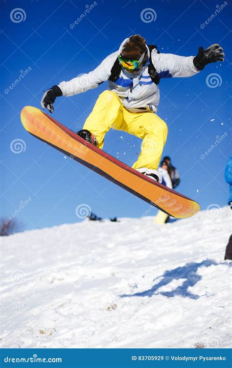 Jumping Snowboarder On Blue Sky Background Editorial Stock Image