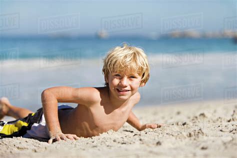 Blonde Boy 7 9 Lying On Sandy Beach Smiling Portrait