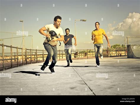2 Men Chasing Another Man Stock Photo Alamy