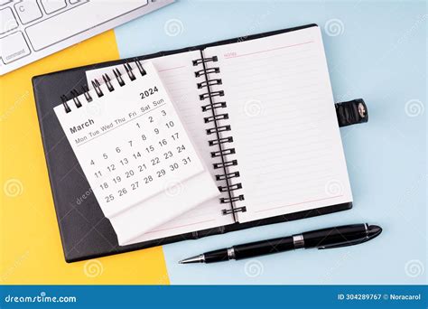 March 2024 Calendar Notepad Pen And Computer Keyboard Stock Image