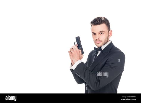 Handsome Secret Agent In Black Suit Holding Gun Isolated On White
