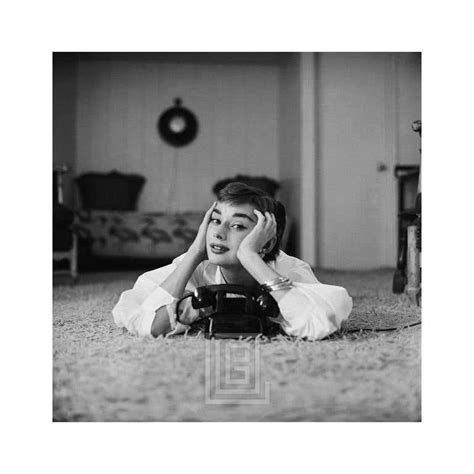 Mark Shaw Audrey Hepburn In White Blouse With Phone Laying Hands On