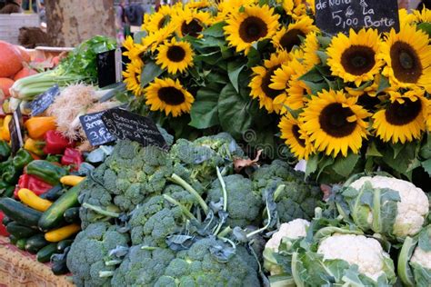 Farmers Market Stall In France With Vegetables And Sunflowers Stock