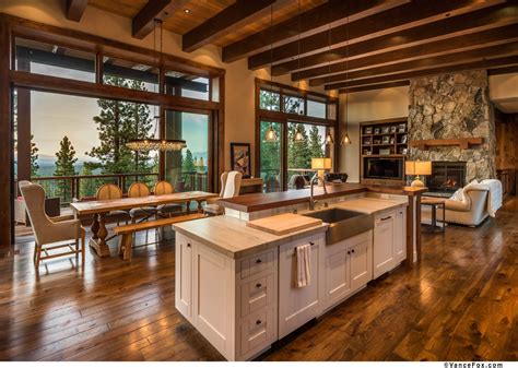 A Large Open Concept Kitchen And Dining Room With Wood Flooring