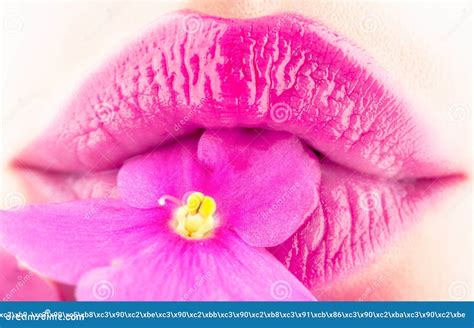 Close Up Lips And Flower Close Up Beautiful Female Lip With Bright Lipgloss Makeup Spa And