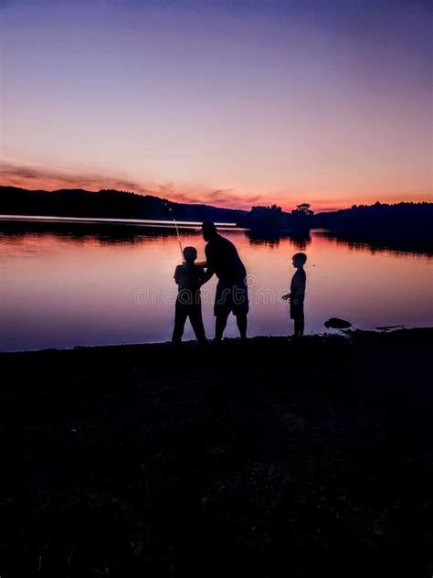 Sunset Silhouette Of Dad Fishing With Kids Stock Image Image Of Kids
