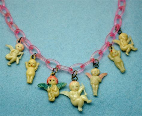 angelic cherubs and kewpies weird jewelry funky jewelry jewelry inspo pretty jewellery cute
