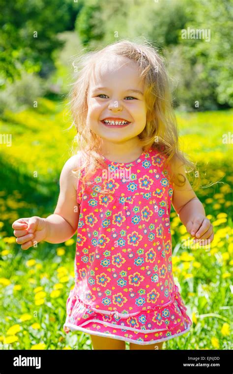 Little Girl In The Park Stock Photo Alamy