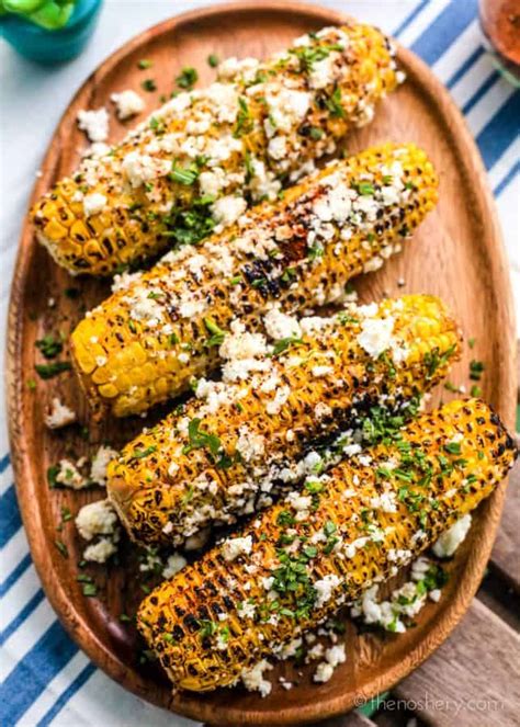 In a separate bowl, whisk lime juice and sour cream in bowl. Elote Corn (Mexican Street Corn) | The Noshery