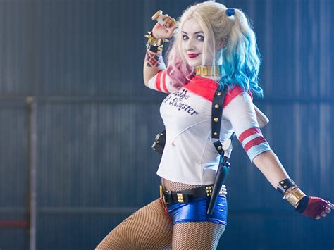 Beauty Holding Cosplay Beautiful Woman Blond Hair Adult Harley Quinn Looking At Camera