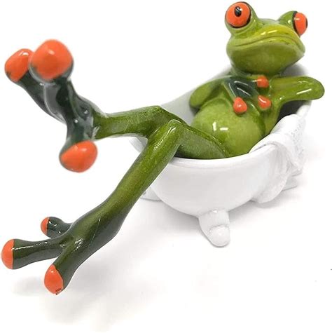 Flyand Funny Green Frog Figurines Lying In The Bathtub