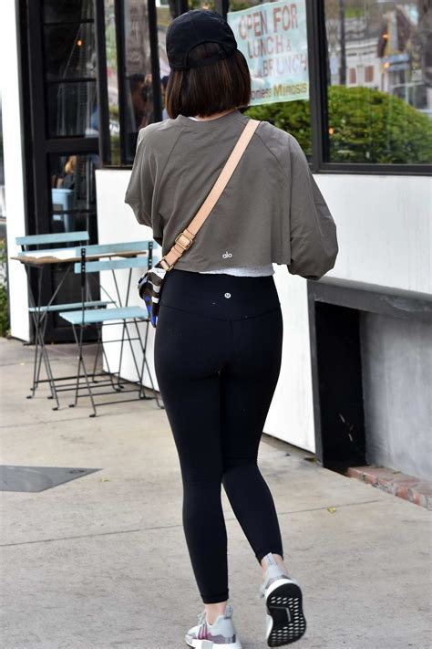 Lucy Hale Sports A Cropped Grey Sweatshirt And Black Leggings While